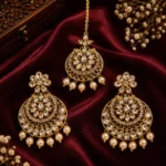 Gold-Plated Traditional Kundan and Pearl Chandbali Earring and Maang Tikka Set.