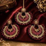 Maroon Meenakari and Kundan Maang Tikka and Earring Set.